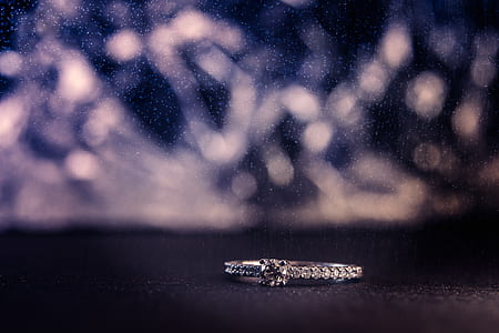 focus photo of silver-colored clear gemstone studded ring thumbnail