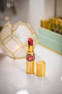 Close-Up Photography of Red Lipstick on Desk thumbnail