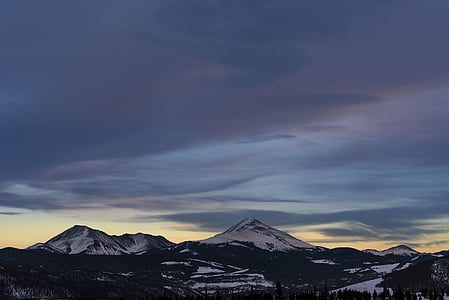 landscape photography of mountain covered with snow at golden hour thumbnail