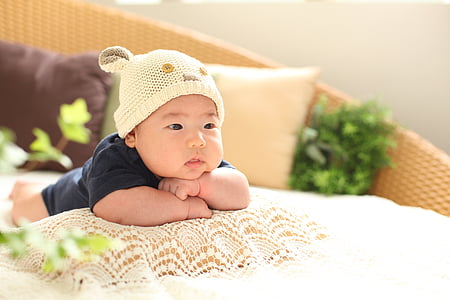 baby wearing beige beanie hat thumbnail