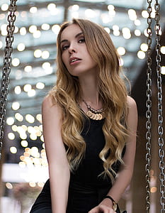 woman wearing black sleeveless dress thumbnail
