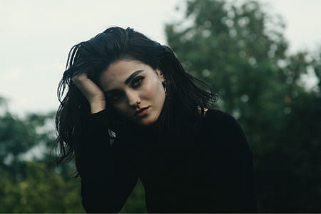 woman wearing black crew-neck long-sleeved shirt thumbnail