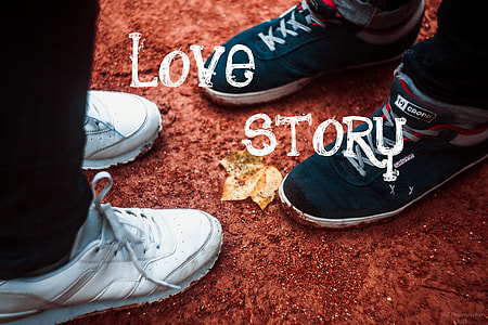 person wearing pair of white low-top athletic shoes in front of another person wearing pair of black Marc Ecko low-top sneakers thumbnail