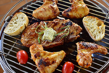 meat grilling on kettle grill thumbnail