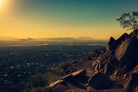 rocky mountain with overview of the building during golden hour thumbnail