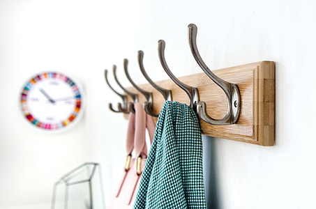 green textile on brown wooden framed peg shelf thumbnail