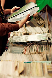Person Looking at Vinyl Disc thumbnail
