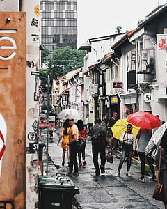 crowd of people walking on narrow street thumbnail