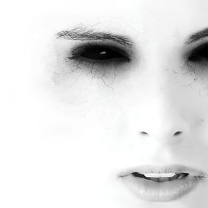 grayscale photography of woman face with camera effects thumbnail
