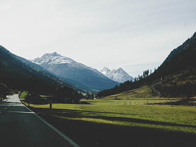 Landscape Photography of Mountains Near Road thumbnail