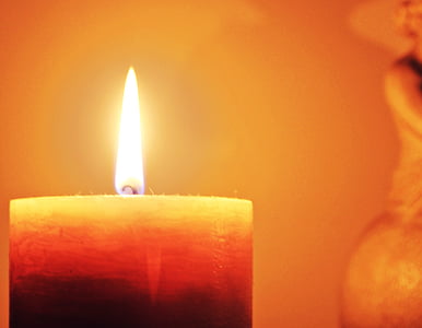 red and white candle closeup photography thumbnail