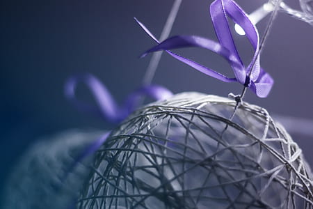 shallow focus photo of purple ribbon thumbnail