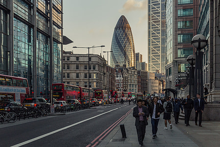 The busy streets of London captured by Liverpool Street station near the financial district, the Gherkin skyscraper dominates the background of the picture. Image taken at sunset with a Canon 6D DSLR thumbnail