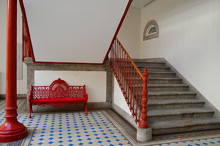 red bench near gray and white stairs thumbnail
