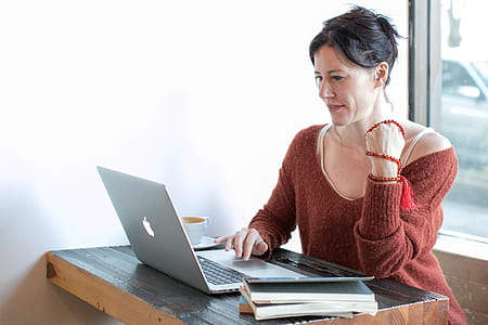 woman sitting on chair using MacBook thumbnail