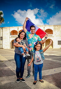 family picture with husband holding flag of France during daytime thumbnail
