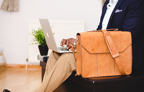 person holding silver MacBook thumbnail