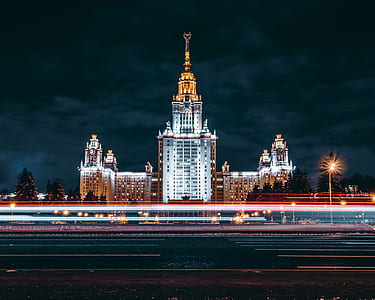 time lapse photography of a white tall building thumbnail