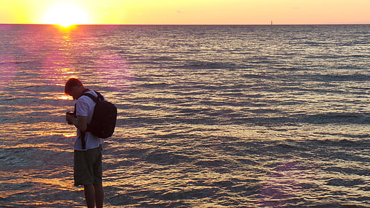 man holding DSLR camera thumbnail