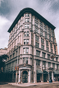 photograph of gray concrete building during daytime thumbnail