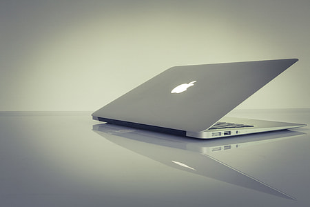 silver MacBook Air on gray surface thumbnail