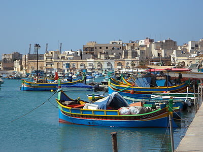 blue boats dock on port under blue sky thumbnail