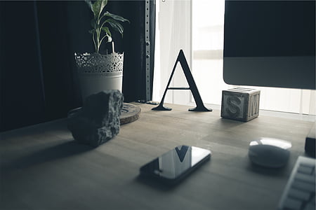 black smartphone on desk thumbnail