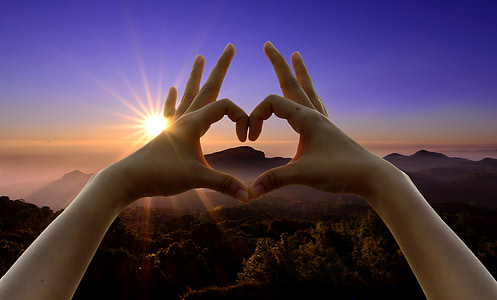 human hands doing heart hand sign thumbnail