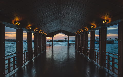 brown wooden dock fronting body of water thumbnail