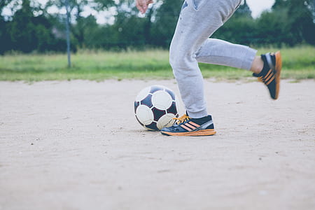 person standing in front of soccer ball thumbnail