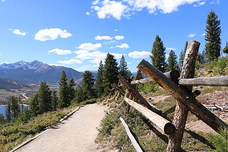 photo of pathway near body of water and mountain thumbnail