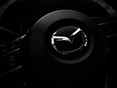 grayscale photography of Mazda vehicle steering wheel thumbnail
