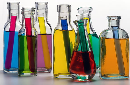 clear glass containers filled with assorted-color liquids thumbnail