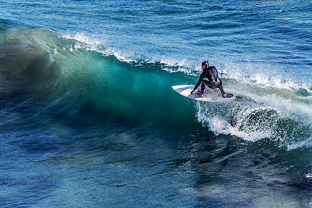 person surfing at daytime thumbnail