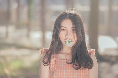 Photo of Woman with Flower on her Mouth thumbnail