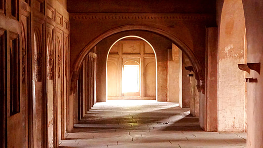 landscape photo of brown concrete arch shaped pathway thumbnail