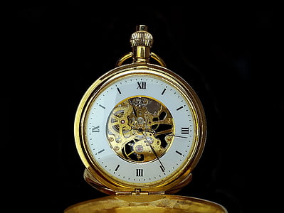 round white and gold-colored pocket watch reading at 11:24 thumbnail