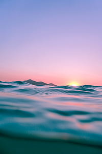 body of water during dawn thumbnail