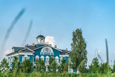 teal and white wooden house low-angle photography thumbnail