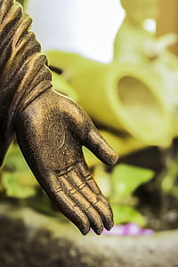 gold statue hand thumbnail