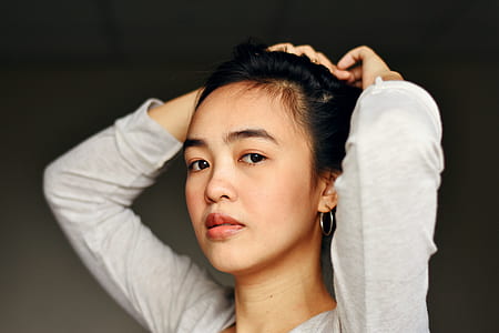 woman fixing hair thumbnail