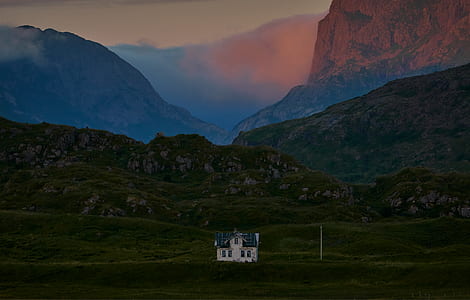 white house and green mountains at daytime thumbnail