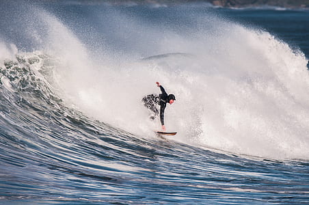 person surfing on waving sea thumbnail