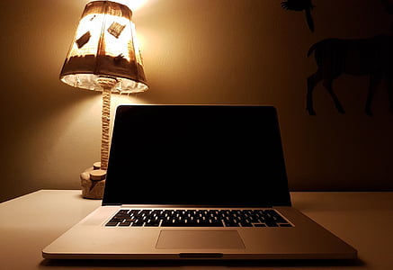 turned off laptop on gray desk thumbnail