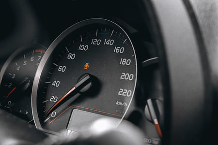 Luxury car interior details. Speedometer and steering wheel thumbnail