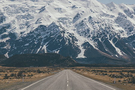 concrete road going through covered mountain thumbnail