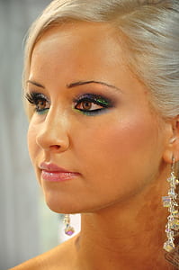 woman wearing clear dangling earrings thumbnail