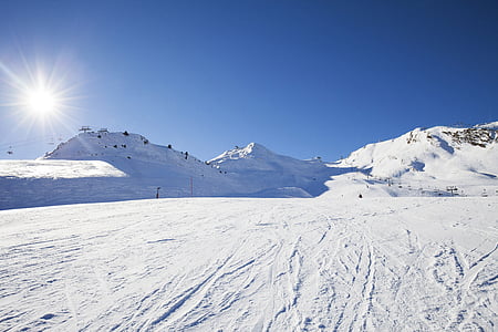 snow field during daytime thumbnail