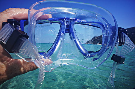 person holding blue goggles thumbnail