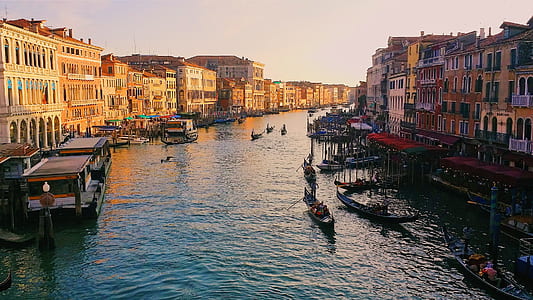 photo of boats on body of water near building thumbnail